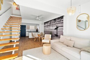 Unwind in the living room where you can find your favourite shows on Amazon Prime, Disney+ and Netflix available on the wall-mounted HDTV. 
