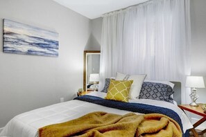 Cozy main bedroom with scrumptious linens