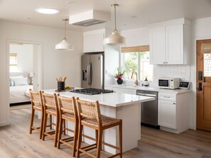 Dining area and fully equipped kitchen for family meals and culinary adventures.
