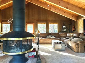 Open floorplan great room with circular fireplace