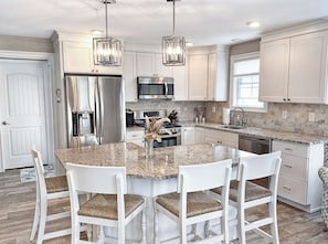 Modern cooking appliances and spacious countertops, the kitchen has it all!