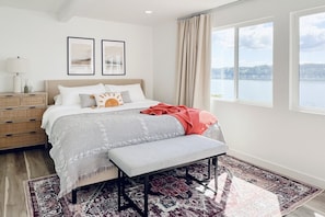 Soothing bedroom with panoramic Hood Canal views and the calming sound of waves crashing outside.