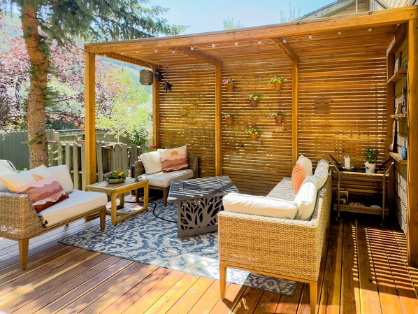 The deck is adjacent to the kitchen. Perfect for entertaining!