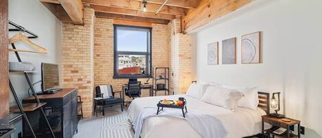 Picture a comforting master bedroom filled with sunlight, providing a welcoming embrace. This room includes a private bathroom for your relaxation, along with a fantastic workspace overlooking the city of Duluth and the William A Irvin.
