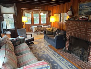 Living room seen from front door with view through to dining room.