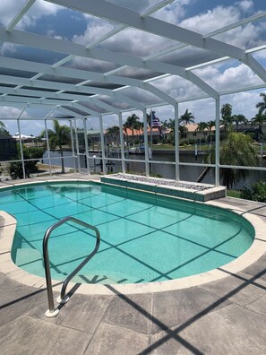 POOL AREA FILLED WITH SUN GIVEN NORTH FACING; STAINED GREY CONCRETE DECKING