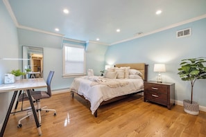 Queen bed and a work station.