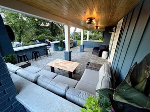 Raining?  No problem!  Enjoy the mountain views sitting on the sectional  or play darts in the covered patio.