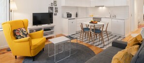 The Sitting Area And Kitchen Of Heart Of Old Town Apartment 1 By Ourmadeira