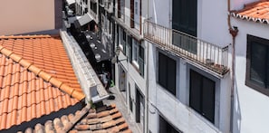 The Heart Of Old Town Apartments In Madeira And A View Of The Narrow Street Of Santa Maria In Funchal Old Town