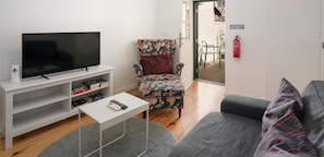 The Sitting Area Of Heart Of Old Town Apartment 2 In Funchal Old Town By Ourmadeira And Door To The Balcony