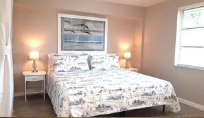 Main, King, has Sliding Glass Door on Left Side to Enclosed Patio. En Suite Bath
