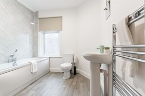 Bathroom with complimentary toiletries provided.