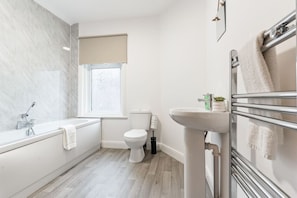 Bathroom with complimentary toiletries provided.