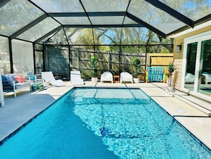 Large pool courtyard that connects a 5/3 main house and a 2/2 cottage.