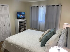 Queen bedroom with 32” smart tv