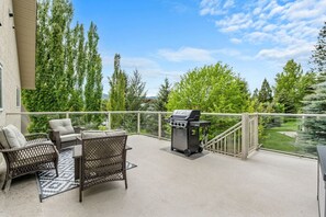 Patio space with outdoor seating & a BBQ (propane's on us!)