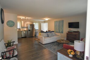 Main living room with open concept into kitchen/ dining area