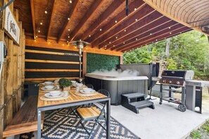 Brand new 6-person hot tub, with a covered outdoor dining area for 8 and gas BBQ.
