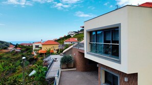 Discover Capelas House by Lovelystay: Aerial view of this modern with moutain & partial ocean view #ribeirabrava #campanário #madeiraisland
