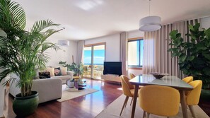 Greeted by a large perspective of this apartment entrance, where unveils a seamless fusion of living and dining spaces. With expansive views and elegant design, relaxation and entertainment converge effortlessly. #diningroom #living room