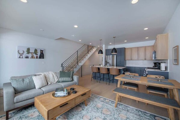 The kitchen and great room is great for hanging out with friends and family. 

Enjoy a movie or catch the game on a brand new 65" Samsung QLED smart TV.