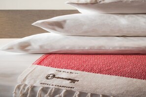 Rest in comfort with plush bedding and thoughtful details  at Hotel 77.
