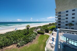 Balcony view of No-Drive New Smyrna Beach and the Shorehom by the Sea pool