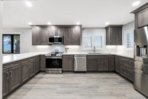 The fully-equipped kitchen has been updated with top-of-the-line appliances