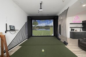 Waterfront Green - Basement level: Golf Simulator in Family & Game Room