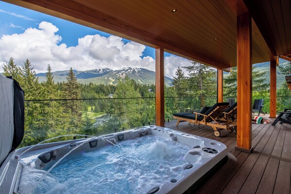 Lower deck with a stunning brand new 12-person hot tub, sun loungers and firepit