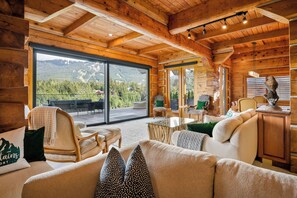 Bright spacious open-plan living room and automatic blinds. 