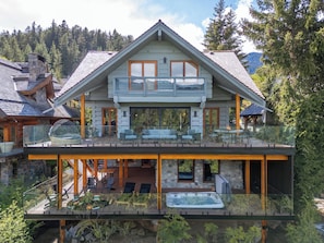 Aerial shot of the back two outdoor decks. 