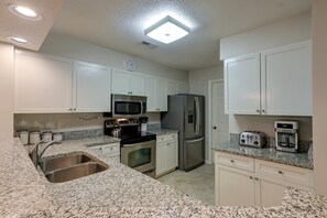 Fully equipped kitchen comes with stainless steel appliances, 
 a Coffee Maker and Keurig, and granite countertops.