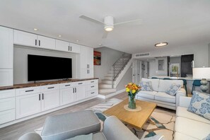 Oversized living room with queen sleeper sofa views of canal