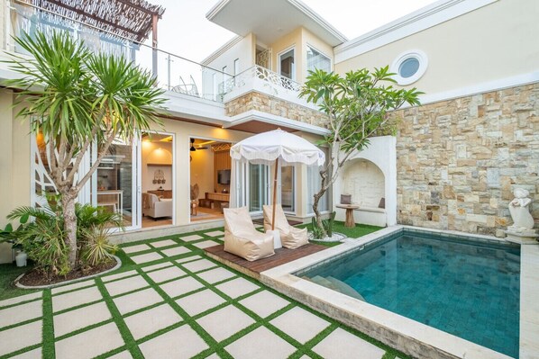 Private swimming pool complete with beanbag and sitting area