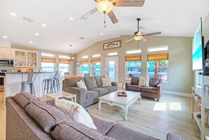 Living room offers comfortable seating and a sleeper sofa.