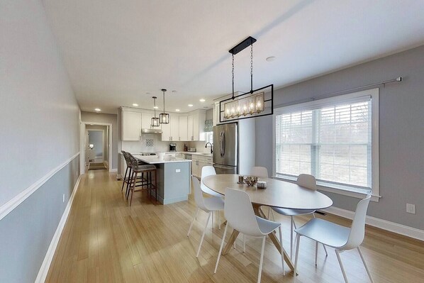 Modern Coastal living - gourmet kitchen with dining area. 