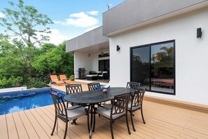Dining table left side of the pool