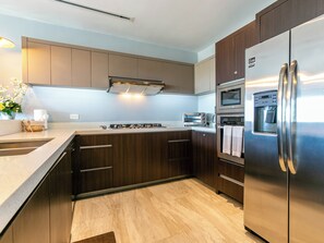 Indulge your culinary passions in the expansive kitchen, fully equipped with all the extras you need for gourmet cooking and entertaining.