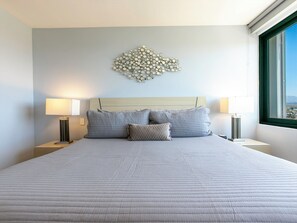 The beautiful master bedroom features a luxurious king bed, an ensuite bathroom, and stunning views, providing a serene and elegant retreat.