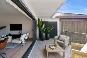 The balcony seamlessly flows into the living area, creating a unified space for relaxation and enjoyment.