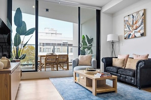 Perfectly paired, our inviting couch beckons for relaxation while the television promises endless entertainment.