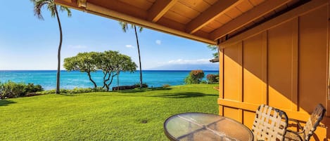 Actual view from the lanai of condo 108. Just a few steps from the ocean, its possible to walk out the sliding door and off the lanai for breathtaking views. Spotting honu (sea turtles) is very common and whales during winter months.