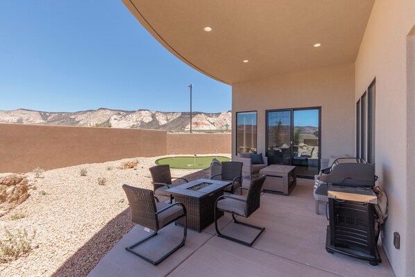 Back Patio Fire Pit - Stay warm next to the fire-pit and relax while watching the sunset over the red mountains.