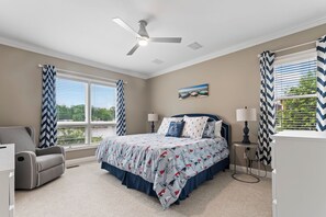 This spacious main-floor king suite boasts a private ensuite & Smart TV