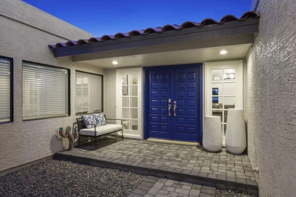 Main entrance of the property with tuff tile flooring and a bunch