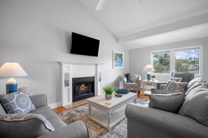 Living Room with Fireplace and Deck Access