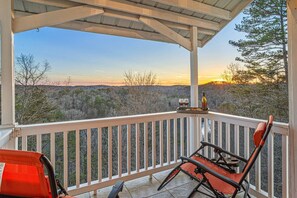 Balcony Bliss: Savor stunning sunset views with a glass of wine in this perfect getaway!
