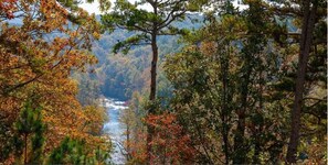 Scenic Viewpoint: Breathtaking river views framed by vibrant autumn foliage await your adventure!
